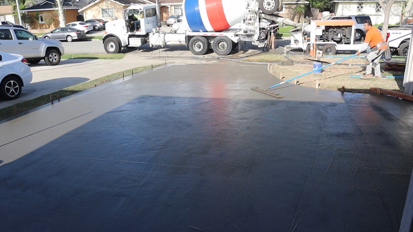 Professional concrete contractors pouring fresh concrete in Evans, GA